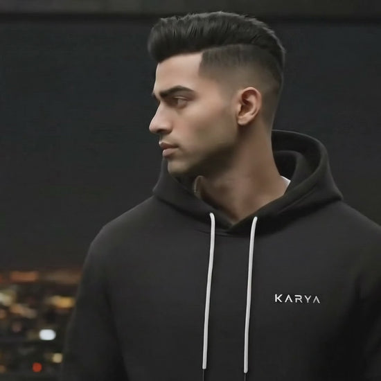 black hoodie karya minimalist logo front

the spirit of action hoodie back print karya

unisex cotton fleece hoodie black minimal design

premium 320 gsm hoodie karya streetwear